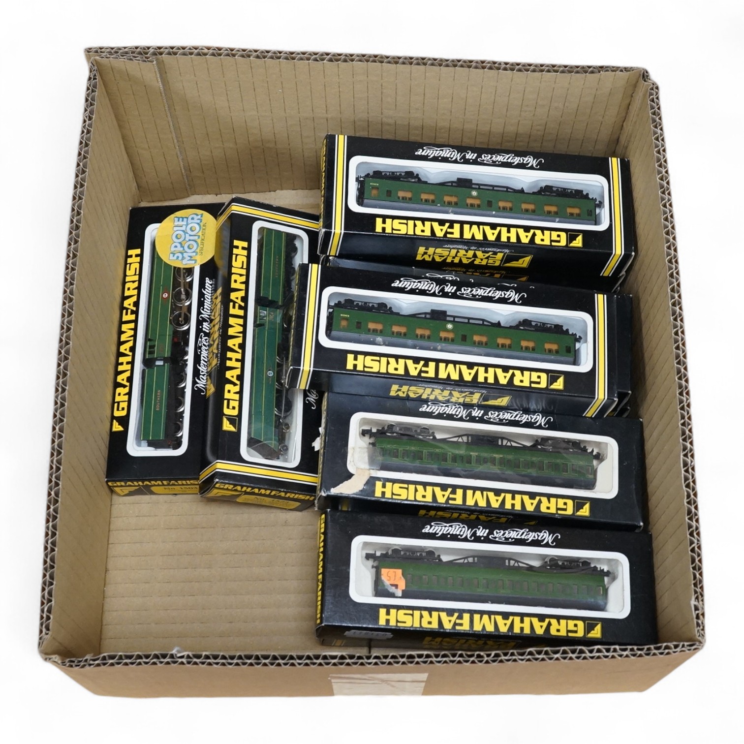 Twelve boxed Graham Farish N gauge Southern Railway, including two locomotives; a Merchant Navy Class 21C17 (1503) and a Merchant Navy Class Cunard White Star (1523), together with ten SR/BRS bogie coaches in green liver
